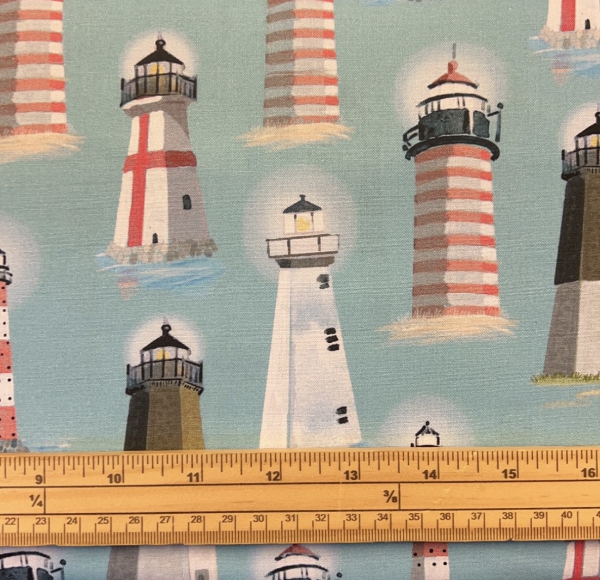 Fat Quarter Pastel Coloured Light Houses On Blue 100% Cotton Quilting Fabric